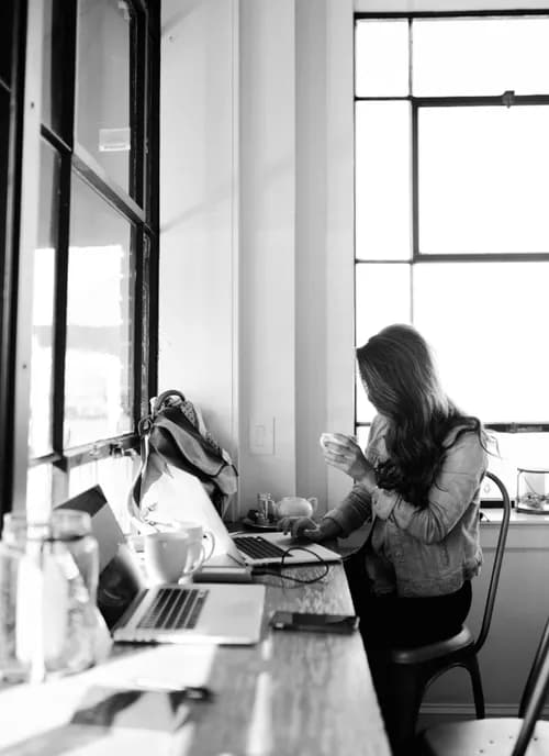 image of a woman in an office using a pc for work